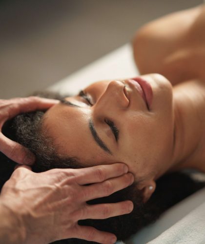 Young woman having relaxing head massage at the spa.