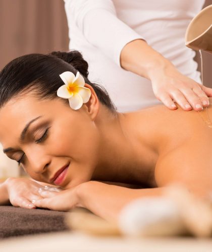 Relaxed Woman Receiving A Back Massage At Health Spa